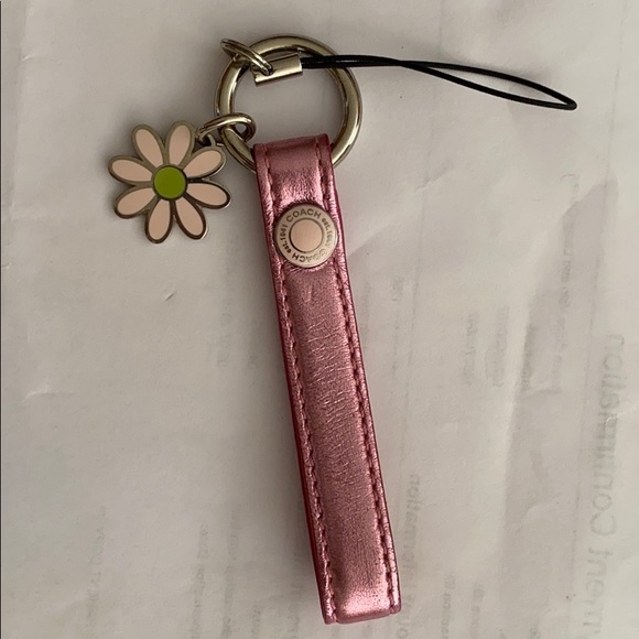 Coach Handbags - Coach pink metallic strap with daisy charm Coach Handbags - Coach pink metallic strap with daisy charm
